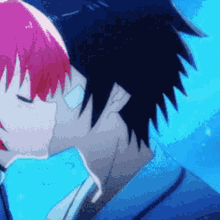 a man and a woman are kissing with a blue background