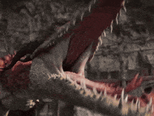 a red dragon with flames coming out of it 's mouth