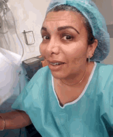 a woman wearing a surgical gown and surgical cap