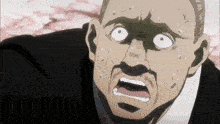 a close up of a man 's face with his mouth open
