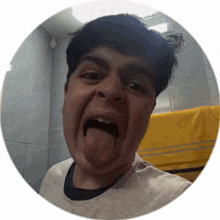 a man sticking his tongue out in a bathroom