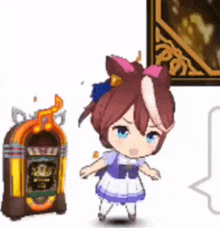 a little girl is standing next to a jukebox and a picture on a wall .