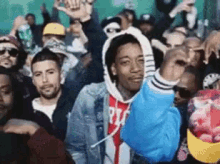 a man in a blue hoodie with the letter p on it