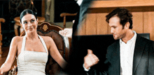a woman in a white dress is sitting in a chair next to a man in a black suit .