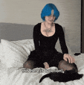 a woman with blue hair sits on a bed with the words " this here is balerion " next to her