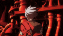 a man with white hair and a red backpack stands in front of red pipes