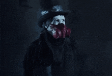 a person wearing a gas mask and top hat