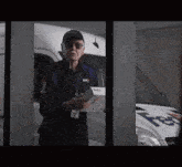 a man in a fedex uniform is standing in front of a van