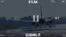 an airplane is taking off from an airport runway and the caption says rylan sliding it