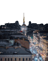 an aerial view of a city at night with a clock tower in the foreground