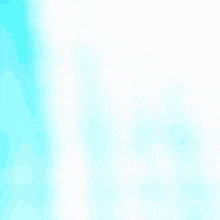 two white plates on a blue table with a person behind them