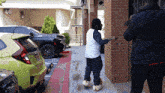 a man wearing slippers is standing in front of a building