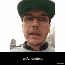 a man wearing glasses and a hat says unfortunately on the bottom