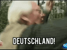 a blurry picture of a man with the words deutschland written on the bottom