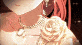 a girl with red hair is wearing a necklace and earrings