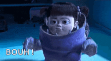 boo is a cartoon character from the movie monsters inc . she is wearing a purple outfit and making a face .