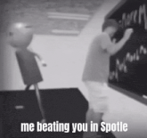 a black and white photo of a boy writing on a blackboard with the caption `` me beating you in spotle '' .