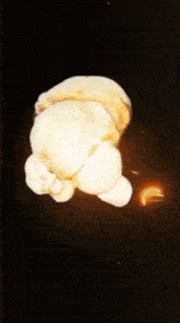 a cartoon explosion with the letter t visible in the center