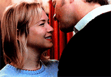 a man and a woman are looking into each others eyes
