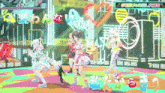 a group of anime girls are dancing on a stage with chinese writing