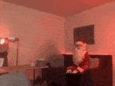 a person dressed as santa claus is sitting on a couch in a living room