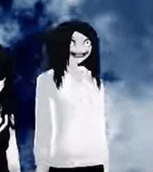 a woman with long black hair is standing next to a man in a white shirt .