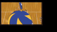 a blue and yellow volleyball is on a court
