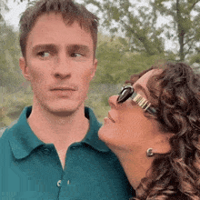 a man and a woman are looking at each other