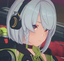 a close up of a girl wearing headphones and a necklace with the letter o on it