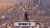 a person standing on top of a building with the word winner above them