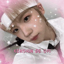 kenshin de opi is written in pink on a picture of a person