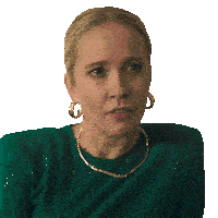a woman wearing gold hoop earrings and a green shirt