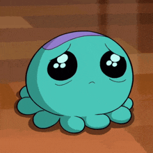 a blue cartoon character with a sad look on his face