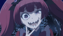 a girl with red hair and black nails is making a face