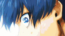 a close up of a person 's eyes with blue hair