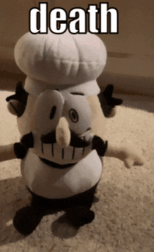a stuffed chef with the word death written on the top