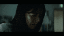 a woman in a lab coat is standing in a dark room next to a bunk bed