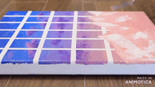 a purple and pink painting is being made in animatica