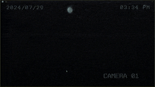 a white circle with the words camera 01 written on it