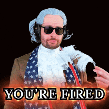a man wearing a wig and sunglasses with the words you 're fired below him