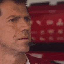 a close up of a man wearing a headset looking at something .