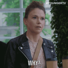 a woman in a leather jacket says " why "