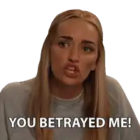 a woman says you betrayed me with a sticker on her face