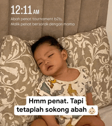 a baby is sleeping on a bed with the time 12:11
