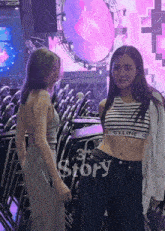 a woman in a celine crop top stands next to a woman in a grey dress