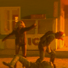 a couple of people are dancing in front of a uc sign