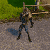 a werewolf is standing on a dirt road