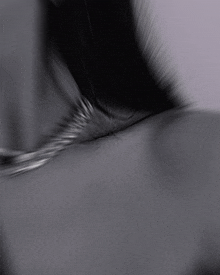 a blurred image of a person 's face and neck