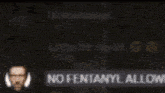 a blurry picture of a man wearing headphones and a sign that says `` no fentanyl allowed '' .