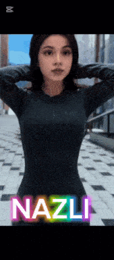 a woman in a black bodysuit with the name nazli on it